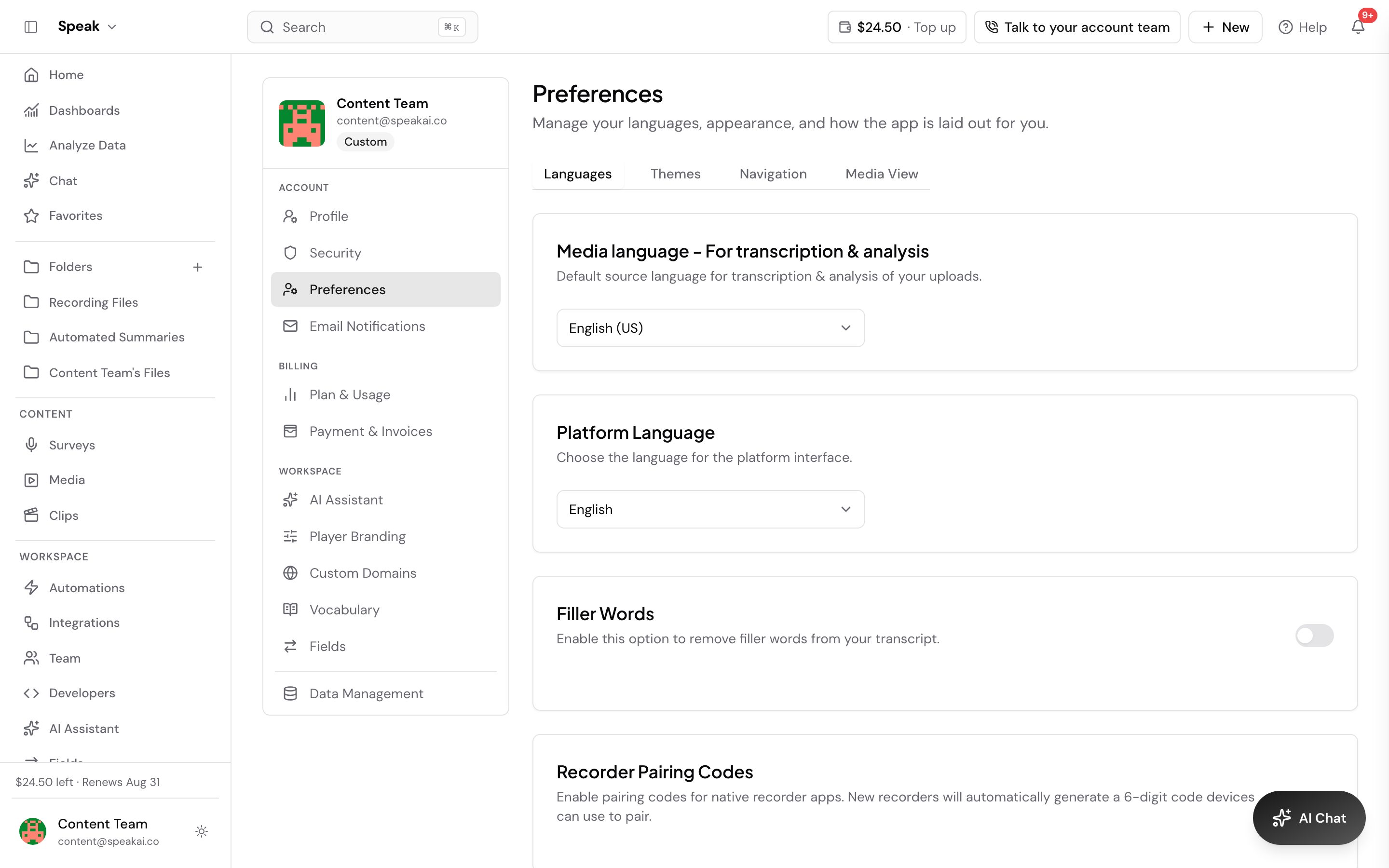 The Preferences page in Speak, reached from the account menu. Its four tabs read Languages, Themes, Navigation and Media View, with Languages open and showing Media language for transcription and analysis set to English (US), Platform Language set to English, and toggles for Filler Words and Recorder Pairing Codes below.