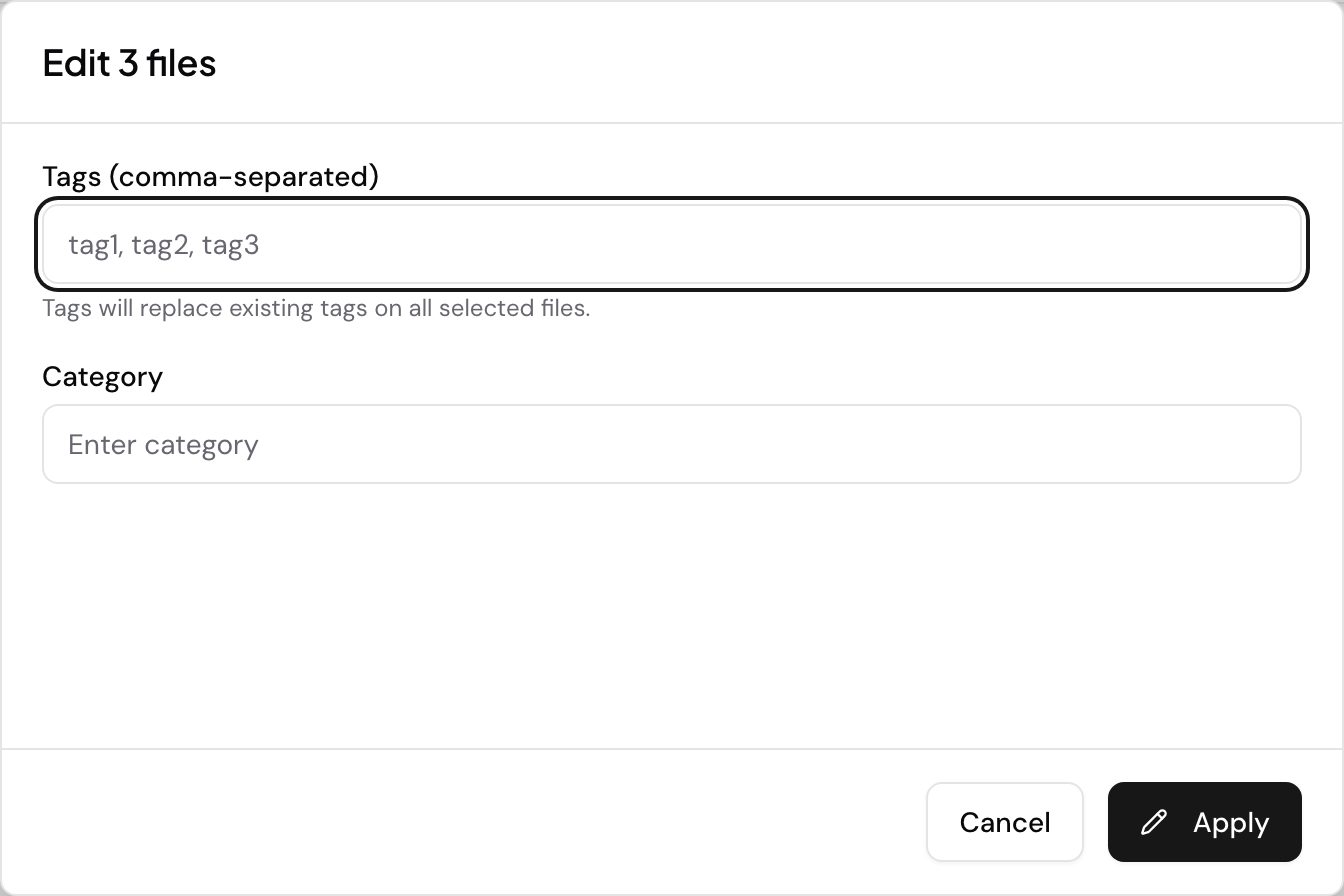The bulk edit dialog for three selected files. A comma-separated Tags box warns that what you type replaces the existing tags on every selected file, a Category box sits below it, and an Apply button commits the change to all three.